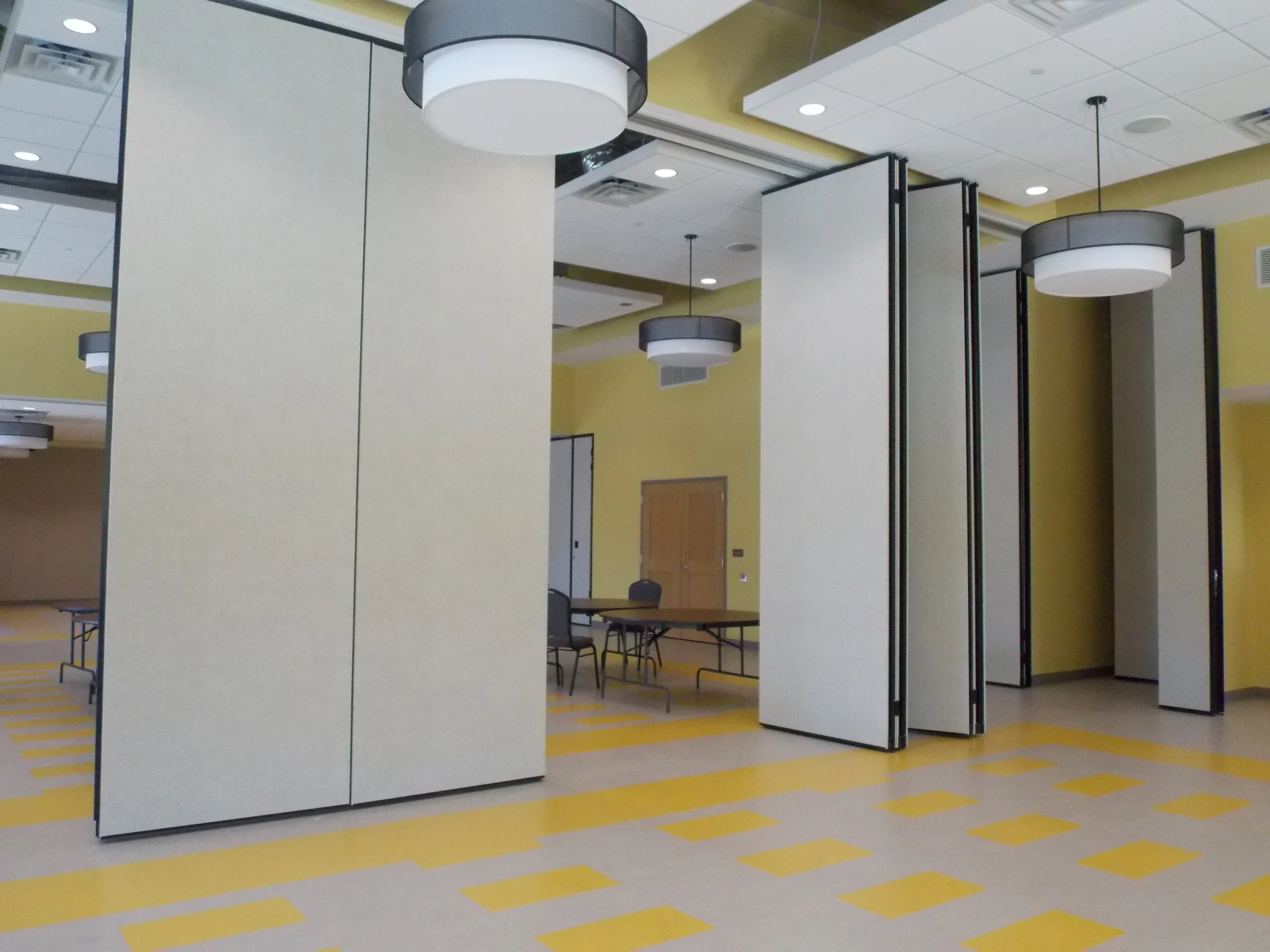 Operable partition with paired panels partly open
